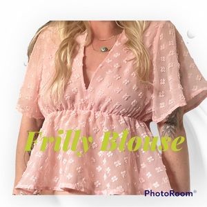 Pink frilly blouse